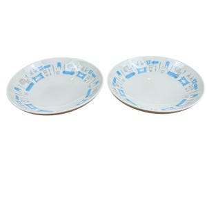 May include: Two white ceramic plates with a blue and gray geometric pattern around the rim. The plates have a slightly oval shape and are set against a white background. The design includes stylized shapes.
