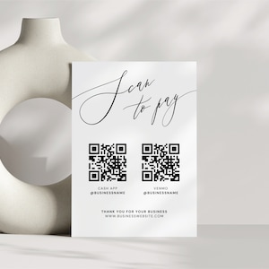 May include: White card with the text "Scan to Pay" in black cursive script. Two black and white QR codes are below the text, one labeled "Cash App @BUSINESSNAME" and the other labeled "Venmo @BUSINESSNAME". The text "Thank you for your business" and "www.BUSINESSWEBSITE.com" are below the QR codes.