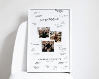 May include: A white framed graduation sign with a black border. The sign has a collage of photos of a graduate in a cap and gown. The sign also has the graduate's name, Amanda Lynn Dewitt, and the year, Class of 2023. The sign is filled with handwritten messages of congratulations.