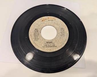 Tom Petty & The Heartbreakers « Refugee / It's Rainin' Again » Vinyle 45 tours (Disque VG+)
