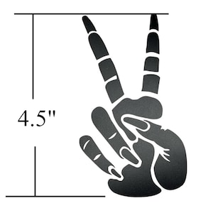 May include: Black peace sign hand gesture silhouette, 4.5 inches tall.