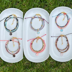 Adjustable Triple String Bracelets. Glass Seed Beads Bracelets. Initial Letter Adjustable Bracelets. Customized Bracelets.