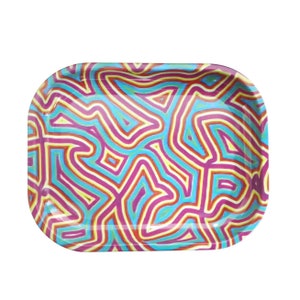 May include: A rectangular metal tray with a colorful abstract design. The tray features a pattern of pink, yellow, blue, and orange lines.