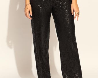 Pantalón negro de cintura alta con lentejuelas en tejido elástico
