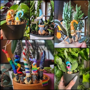 May include: A collection of colorful, handmade gnome figurines with different designs and patterns. The gnomes are made of polymer clay and have a whimsical, fairy tale aesthetic.