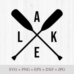 May include: Black and white silhouette of two crossed paddles with the letters "LAKE" in the center.