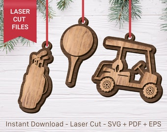 Könnte beinhalten: Drei Holzornamente, die mit einem Laser in Form einer Golftasche, eines Golftees und eines Golfwagens geschnitten wurden. Die Ornamente hängen an einer roten Schnur vor einem weißen Holz Hintergrund.