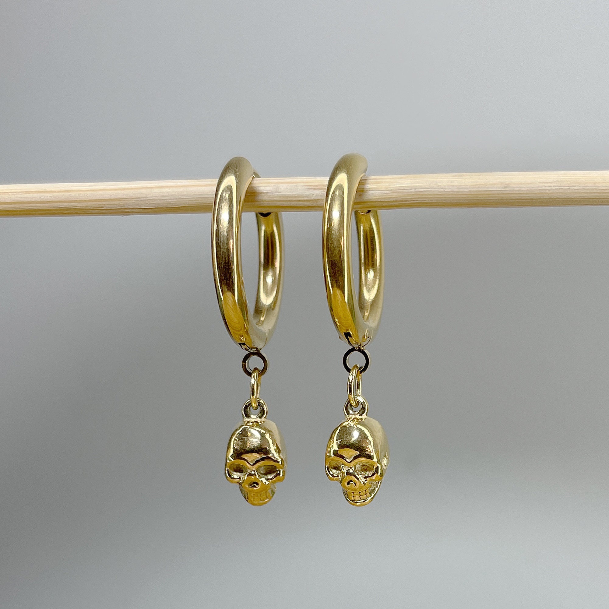 Pair of 316L Surgical Steel Hoop Earrings with Skull Dangle • 20ga