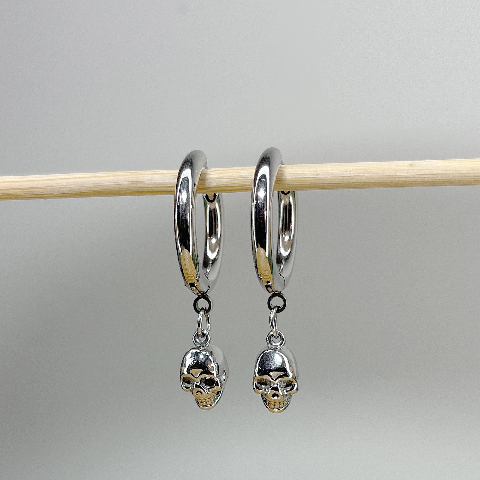 Pair of 316L Surgical Steel Hoop Earrings with Skull Dangle • 20ga