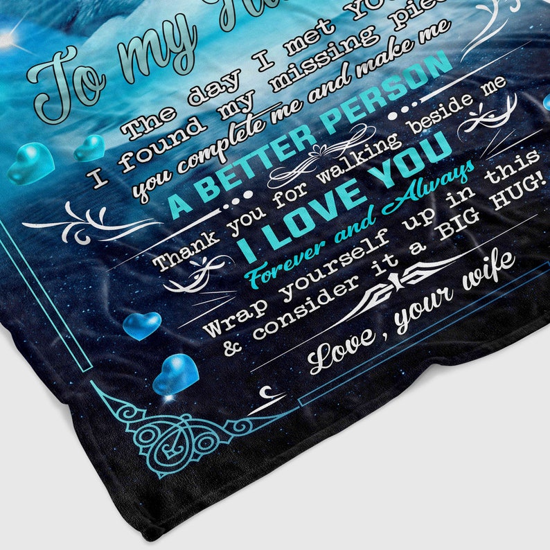 May include: A blue and black blanket with a message that reads "To my... The day I met you I found my missing piece you complete me and make me A BETTER PERSON... Thank you for walking beside me I LOVE YOU Forever and Always Wrap yourself up in this & consider it a BIG HUG! Love, your wife"