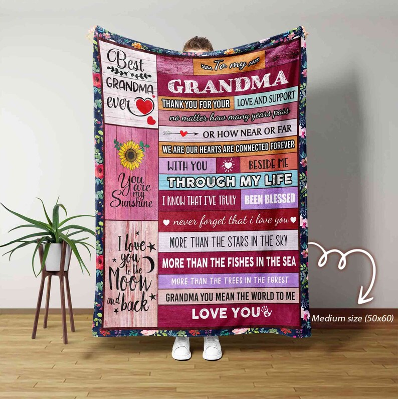 May include: A soft, colorful fleece blanket with a message for a grandma. The blanket features a sunflower, a heart, and the words "Best Grandma Ever". The text on the blanket reads "To my Grandma, Thank you for your love and support, no matter how many years pass or how near or far we are, our hearts are connected forever. With you beside me through my life, I know that I've truly been blessed, never forget that I love you. More than the stars in the sky, more than the fishes in the sea, more than the trees in the forest, Grandma you mean the world to me, Love you". The blanket is 50 inches by 60 inches.