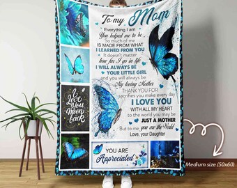 May include: A blue and white fleece blanket with a butterfly design and the text "To my Mom" and "You are Appreciated". The blanket is 50 inches by 60 inches.