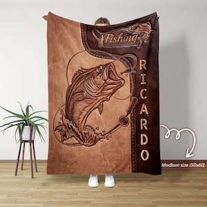 May include: A brown and tan fishing-themed blanket with a large fish graphic and the word "Fishing". The blanket also features the name "Ricardo" in a vertical font. The blanket measures 50x60 inches.
