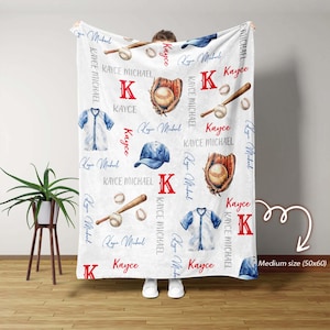 May include: White baseball-themed blanket with baseballs, bats, gloves, and a baseball uniform design. The blanket features the name "Kayce" and the initial "K" in red. The blanket is a medium size, 127x152 cm.