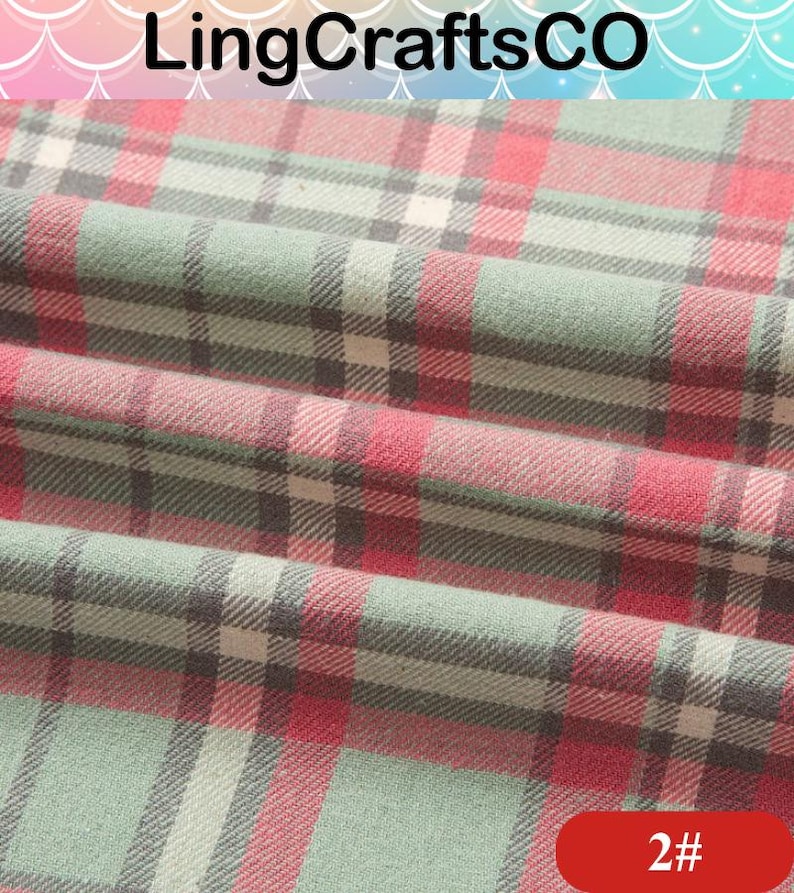 May include: A folded fabric featuring a plaid pattern in shades of sage green, red, and white with thin black intersecting lines. The text LingCraftsCO is visible at the top, and the number 2# is printed in white on a red rounded rectangle.