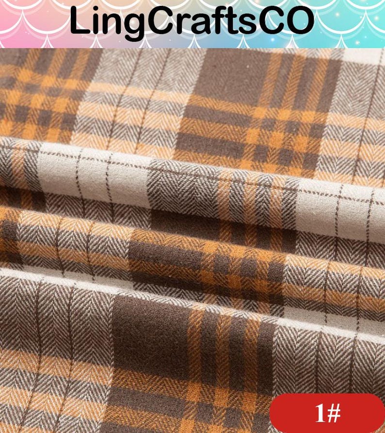 May include: A fabric featuring a plaid pattern in shades of brown, mustard yellow, and off-white. The textile displays a visible herringbone weave texture throughout the design, with the fabric folded to create soft, horizontal pleats across the surface.
