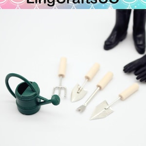 May include: Miniature gardening tools set, including a green watering can, a small rake, and two trowels with wooden handles. The set also includes black gloves and boots. The LingCraftsCO logo is at the top.