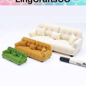 May include: Miniature sofas in green, gold, and cream colors. The sofas have matching pillows and are arranged in a group. A black marker is in the foreground. The LingCraftsCO logo is at the top.