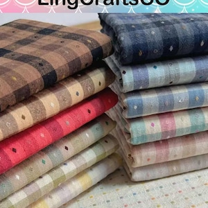 May include: Two stacks of folded fabric squares featuring a checkered pattern with small, evenly spaced embroidered dots. The colors include brown, red, green, yellow, blue, and pink tones. The text LingCraftsCO is visible at the top.