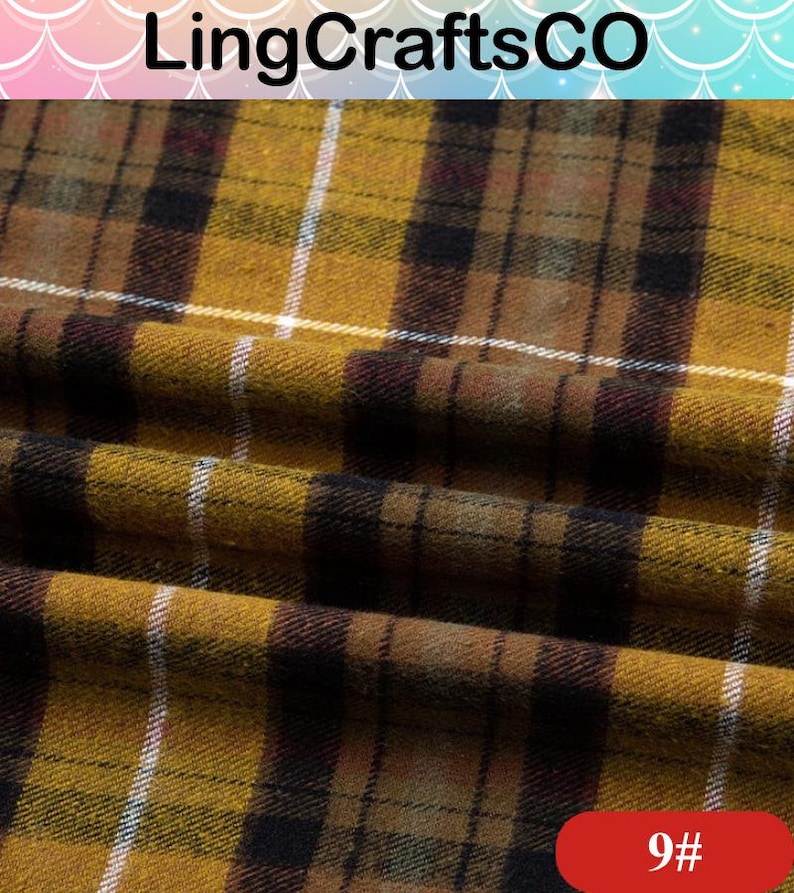 May include: A mustard yellow fabric featuring a dark brown and black plaid pattern with thin white vertical and horizontal lines. The textile has a soft, slightly fuzzy texture and is draped to show folds. The text LingCraftsCO and 9# are visible.