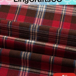 May include: A folded fabric featuring a plaid pattern in shades of deep red, dark brown, and thin white and blue stripes. The text LingCraftsCO is visible at the top, and the number 7# is printed in white on a red rounded rectangle at the bottom.