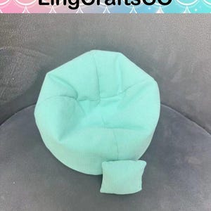 May include: A mint green beanbag chair and a small matching pillow are shown on a grey surface. The beanbag is round with a ribbed texture. The text "LingCraftsCO" is at the top of the image.