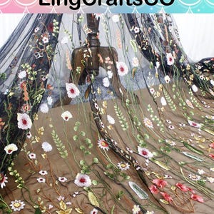 May include: A sheer black tulle fabric featuring intricate multi-colored floral embroidery with various flowers, leaves, and stems in shades of red, pink, white, and green. The text LingCraftsCO is visible at the top of the image.