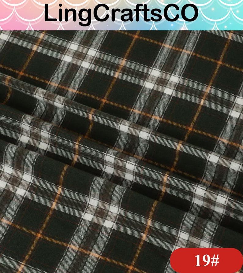 May include: A fabric featuring a dark green, white, and orange plaid pattern. The material is folded, creating visible diagonal drapes across the surface. The text LingCraftsCO is visible at the top, and the number 19# is printed in a red box.