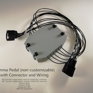 May include: A gray electronic device with a black connector and wiring. The device is labeled "Comma Pedal (non-customizable) with Connector and Wiring". The text below lists compatible vehicles: "All Honda supported vehicle listed by comma, All Toyota supported vehicle listed by comma, Chevy Bolt, Chevy Volt, Tesla pre-AP, VW PQ platform."