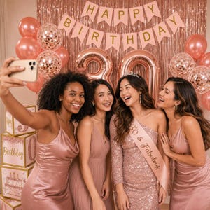 May include: Four women in rose-gold dresses pose for a selfie at a birthday party. The background includes balloons, a banner that says "Happy Birthday", and large number balloons. One woman wears a sash that says "30 & Fabulous".