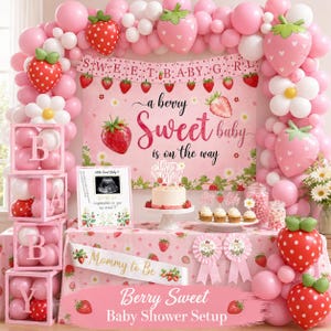 Peut inclure: D&eacute;coration de baby shower rose et blanche sur le th&egrave;me des fraises. La sc&egrave;ne comprend des ballons, une banni&egrave;re avec l'inscription "Sweet Baby Girl", un g&acirc;teau et une table avec le texte "Mommy to Be" et "Berry Sweet Baby Shower Setup".