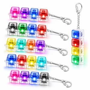 May include: A collection of mechanical keyboard switch keychains, each featuring four translucent, multi-colored square keycaps with a plus-shaped stem. These keychains include integrated LED lights that glow in various colors and a metal chain.