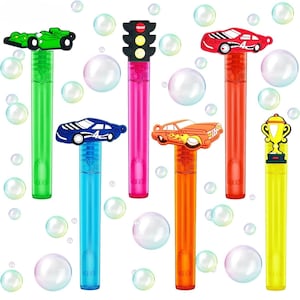 May include: Six colorful bubble wands with different car and traffic light designs. The wands are made of plastic and have a clear tube with a colorful top. The tops feature a variety of designs, including a green race car, a red race car, a blue race car, an orange race car, a traffic light, and a trophy.