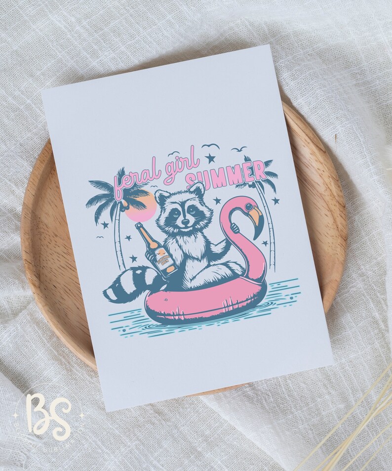 May include: A raccoon wearing a blue shirt sits on a pink flamingo pool float with a bottle of beer in its hand. The raccoon is surrounded by palm trees and stars. The text "feral girl summer" is written above the raccoon.