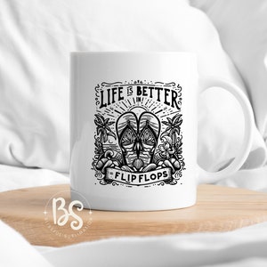May include: White ceramic mug with a black and white graphic design. The design features a pair of flip flops, palm trees, and the text "Life is better in flip flops".