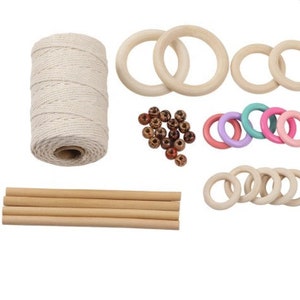 May include: A set of wooden rings, wooden dowels, twine, and colorful beads for crafting. The rings are in various sizes and are perfect for making a macrame wall hanging.