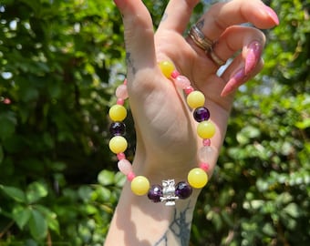 AAA grade amethyst, AAA grade Thulite, AAA grade Madagascar rose quartz, and lemon serpentine crystal bracelet 7 1/4”