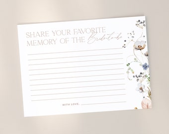 Op de afbeelding: Een witte kaart met de tekst "SHARE YOUR FAVORITE MEMORY OF THE Bride-to-be" in een lichtbruine lettertype. De kaart heeft gelijnde ruimtes om te schrijven en bloemen aquarel illustraties.