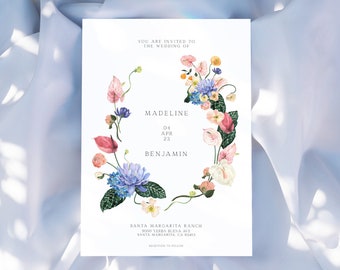 May include: A wedding invitation with a floral wreath design. The invitation is for Madeline and Benjamin, and the wedding is on April 4th, 2023 at Santa Margarita Ranch.