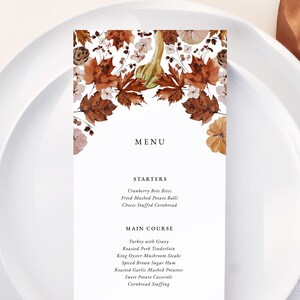 May include: A fall-themed menu with a watercolour illustration of leaves, gourds, and flowers. The menu lists starters and main courses for a Thanksgiving dinner.