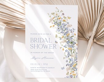 May include: A white card with blue and yellow floral illustrations and butterflies. The text on the card reads "Please join us for a Bridal Shower in honor of the bride Myra Hanson 06.18.24 | 3PM Santa Margarita Ranch 9000 Yerba Buena Ave, Santa Margarita, CA 93454"