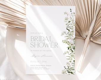 Puede incluir: Una tarjeta blanca con un borde floral verde y texto que dice "Join us for a Bridal Shower en honor a la novia, Mzra Hanson, 10.02.24 | 15:00, Santa Margarita Ranch, 9000 Yerba Buena Ave., Santa Margarita, CA 93453".