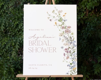 May include: White bridal shower sign with a floral border. The text reads "Welcome to Angelina's Bridal Shower, Santa Clarita, CA 06.24.24".