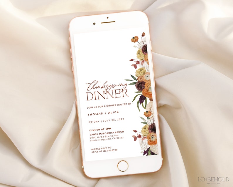 May include: A smartphone displays a Thanksgiving dinner invitation. The design features floral accents in shades of orange, burgundy, and cream. The text reads "Thanksgiving Dinner" and includes event details.