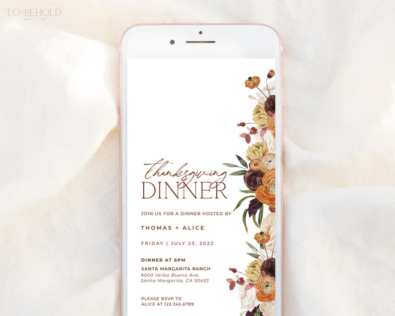 May include: A digital invitation on a smartphone screen for a Thanksgiving dinner. The invitation features the words "Thanksgiving Dinner" in a script font, with floral accents in shades of orange, brown, and cream. Details include the date, time, and location.