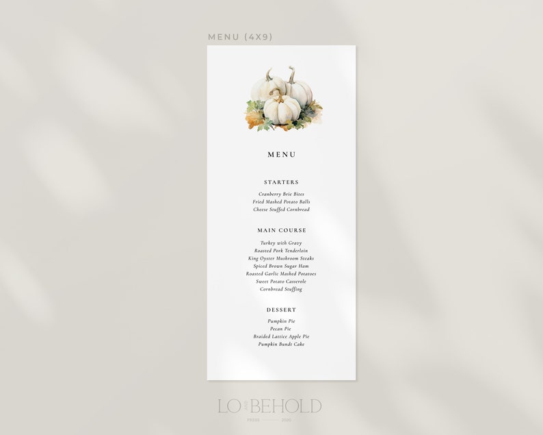 May include: A white menu card with a watercolor illustration of white pumpkins with green leaves. The menu card lists a Thanksgiving dinner menu with starters, main course, and dessert options. The text on the menu card reads "MENU (4X9)", "MENU", "STARTERS", "Cranberry Brie Bites", "Fried Mashed Potato Balls", "Cheese Stuffed Cornbread", "MAIN COURSE", "Turkey with Gravy", "Roasted Pork Tenderloin", "King Oyster Mushroom Steaks", "Spiced Brown Sugar Ham", "Roasted Garlic Mashed Potatoes", "Sweet Potato Casserole", "Cornbread Stuffing", "DESSERT", "Pumpkin Pie", "Pecan Pie", "Braided Lattice Apple Pie", "Pumpkin Bundt Cake", "LO BEHOLD".