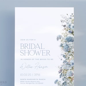 May include: A light blue bridal shower invitation with a watercolor floral design. The invitation reads "Join us for a Bridal Shower in honor of the bride-to-be Willow Hanson 10.02.25 | 3PM Santa Margarita Ranch 9000 Yerba Buena Ave, Santa Margarita, CA 93453"