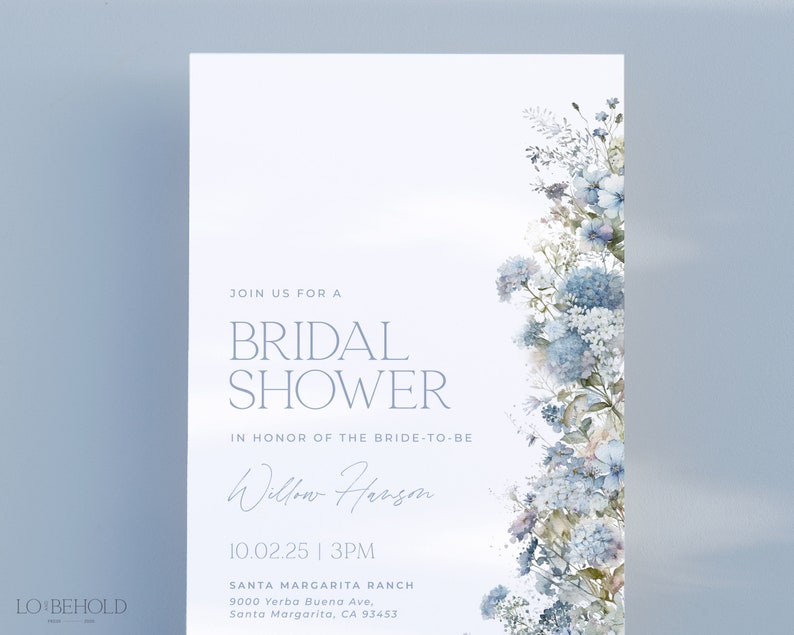 May include: A light blue bridal shower invitation with a watercolor floral design. The invitation reads "Join us for a Bridal Shower in honor of the bride-to-be Willow Hanson 10.02.25 | 3PM Santa Margarita Ranch 9000 Yerba Buena Ave, Santa Margarita, CA 93453"