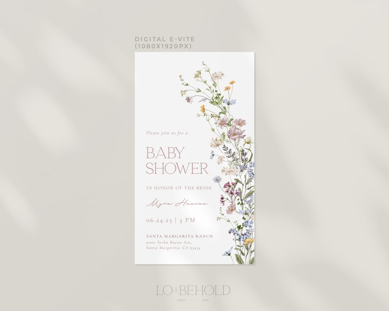 May include: A digital invitation for a baby shower with a floral design. The invitation features a watercolor illustration of wildflowers in shades of pink, blue, yellow, and green. The text reads "Please join us for a Baby Shower in honor of the bride Myra Hansen 06.24.23 | 3 PM Santa Margarita Ranch 2010 Yerba Buena Ave Santa Margarita, CA 93456 LO BEHOLD".