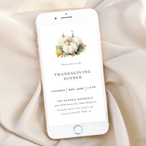 May include: A digital invitation on a smartphone screen for a Thanksgiving dinner. The invitation features a watercolor illustration of white pumpkins and fall leaves. The text reads "Please join us for Thanksgiving Dinner, Saturday, Nov. 26th, 2:30 PM, The Maxwell Residence, 9000 Yerba Buena Ave., Santa Margarita, Please RSVP to Alice at 123-345-6789 by Nov 20."